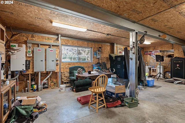 garage featuring electric panel and a workshop area