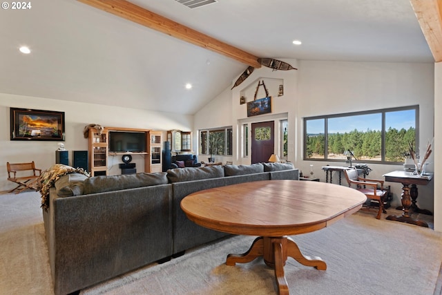 living room with high vaulted ceiling, carpet, and beamed ceiling