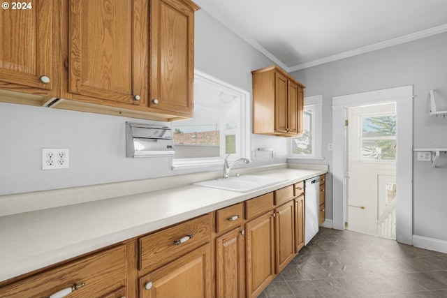 kitchen featuring dishwasher, crown molding, sink, and tile patterned floors