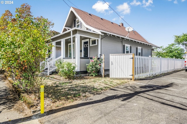 view of property exterior with covered porch