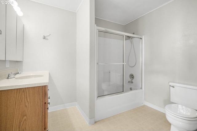 full bathroom featuring ornamental molding, vanity, toilet, and combined bath / shower with glass door