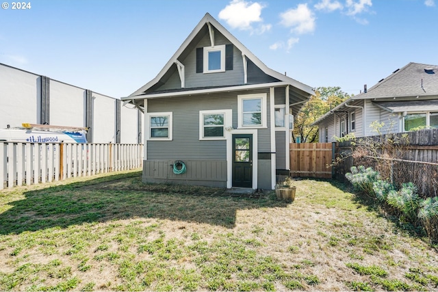 back of house featuring a yard