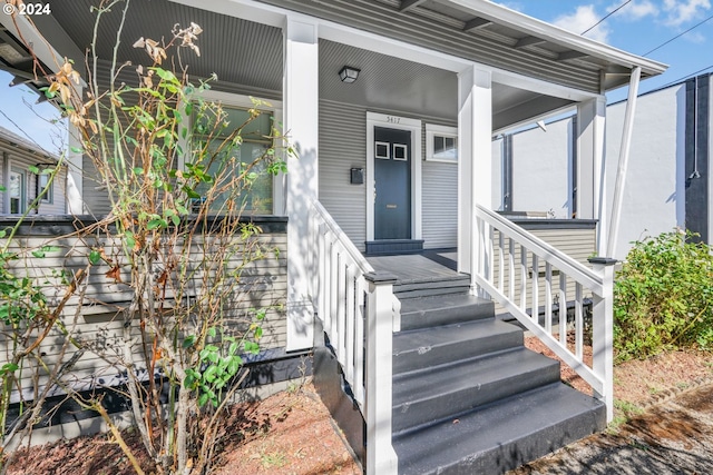 doorway to property featuring a porch