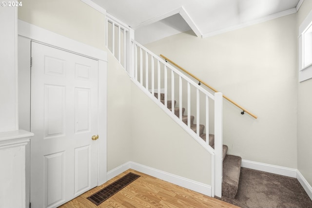 stairs with wood-type flooring