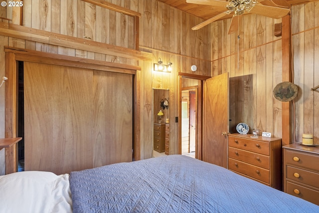 bedroom with wooden walls