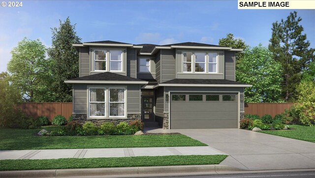 view of front facade featuring a front yard and a garage