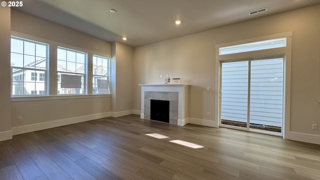 13910 SW 166th Ave, Tigard, OR 97223 - unfurnished living room featuring a tile fireplace, wood finished floors, and recessed lighting