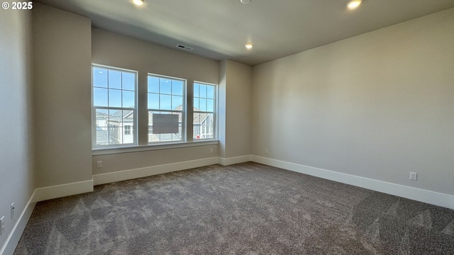 13910 SW 166th Ave, Tigard, OR 97223 - empty room featuring dark colored carpet and recessed lighting
