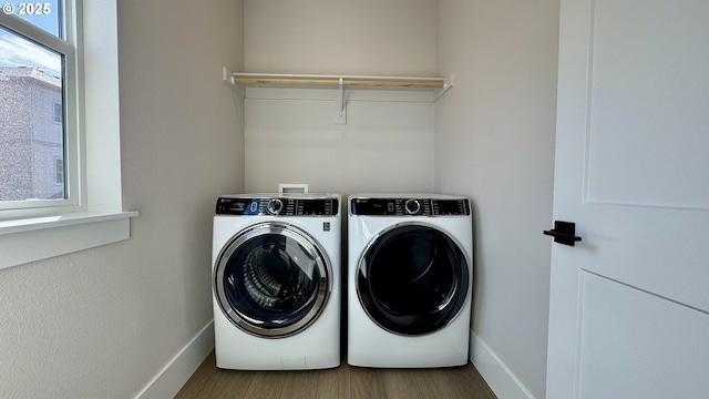 13910 SW 166th Ave, Tigard, OR 97223 - laundry room with washer and dryer and wood finished floors