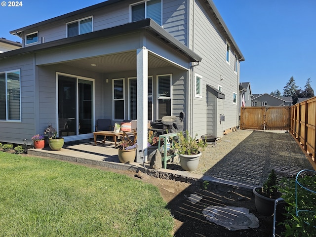 rear view of house with a patio