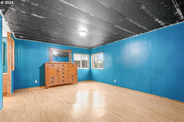 interior space featuring wood walls and hardwood / wood-style floors