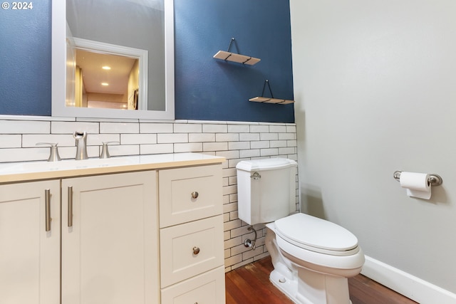 bathroom featuring hardwood / wood-style floors, vanity, and toilet