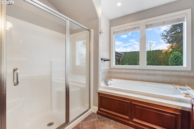 bathroom featuring tile patterned flooring and independent shower and bath