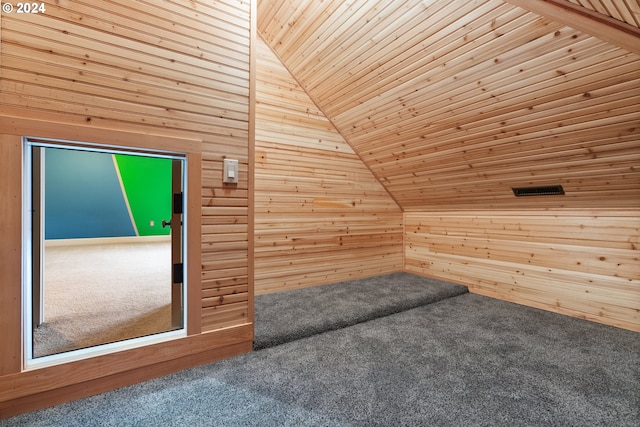 bonus room with carpet, wood walls, wood ceiling, and vaulted ceiling