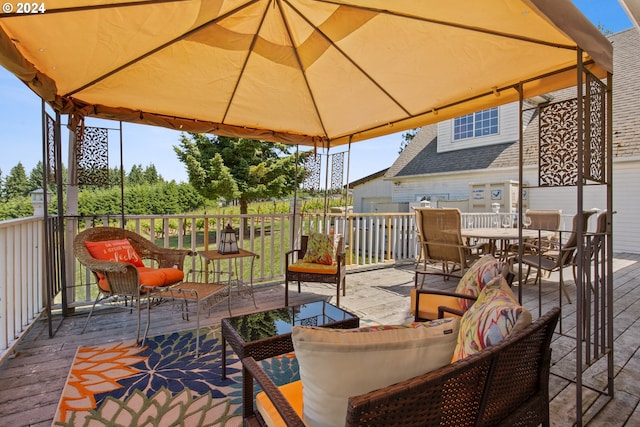 wooden deck with a gazebo and outdoor lounge area