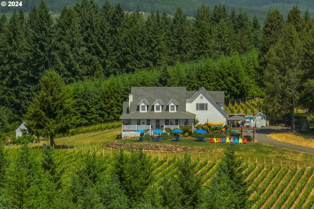 birds eye view of property with a rural view