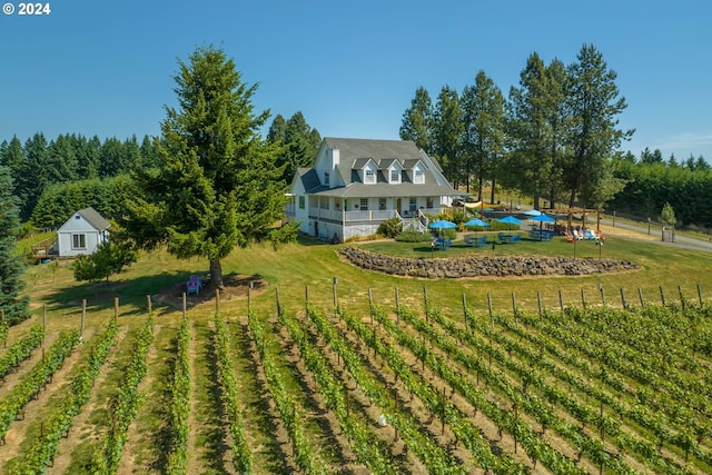 rear view of property with a yard and a rural view