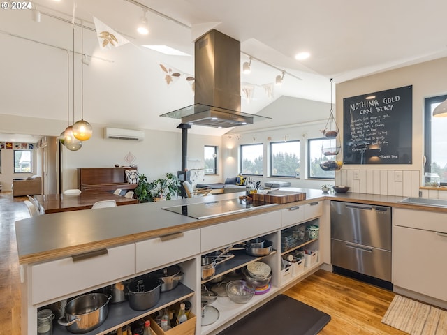 kitchen featuring black electric cooktop, island range hood, white cabinets, stainless steel dishwasher, and decorative light fixtures