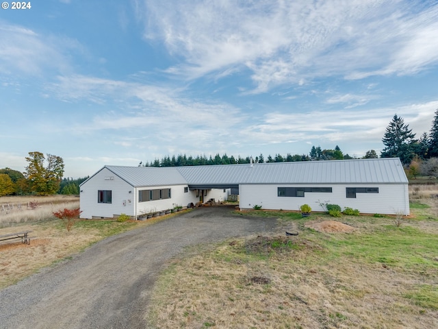 view of front of home featuring a carport