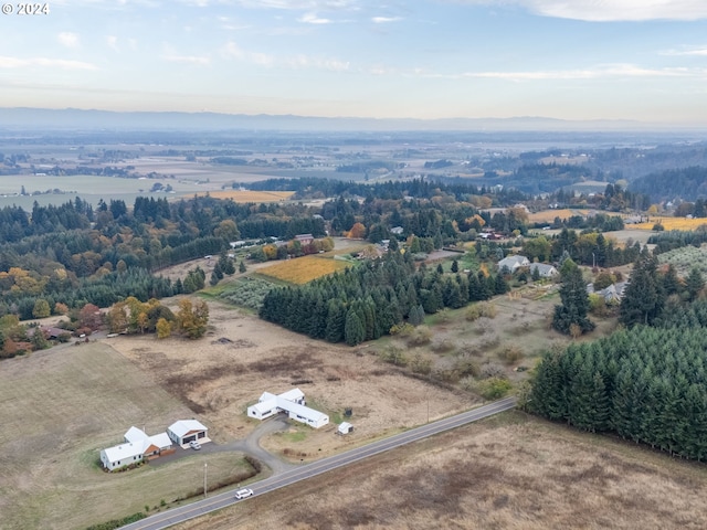 birds eye view of property with a rural view