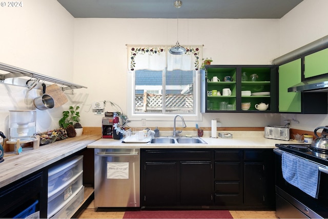 kitchen featuring light hardwood / wood-style floors, sink, pendant lighting, and stainless steel appliances