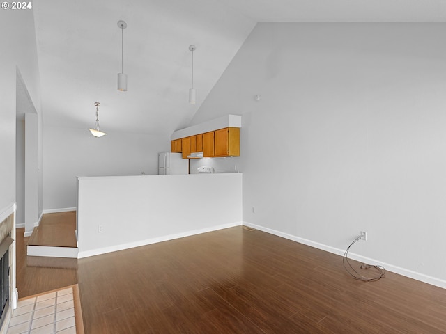 unfurnished living room featuring a fireplace with flush hearth, high vaulted ceiling, wood finished floors, and baseboards