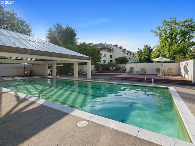 view of pool with a deck, a gazebo, and a fenced in pool