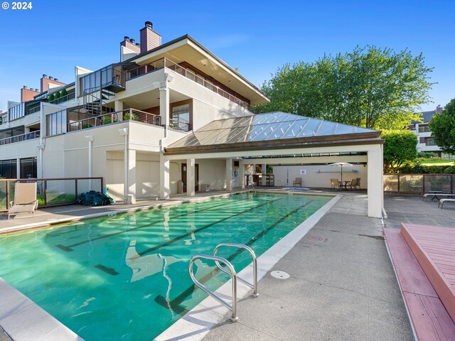 view of swimming pool with a patio area