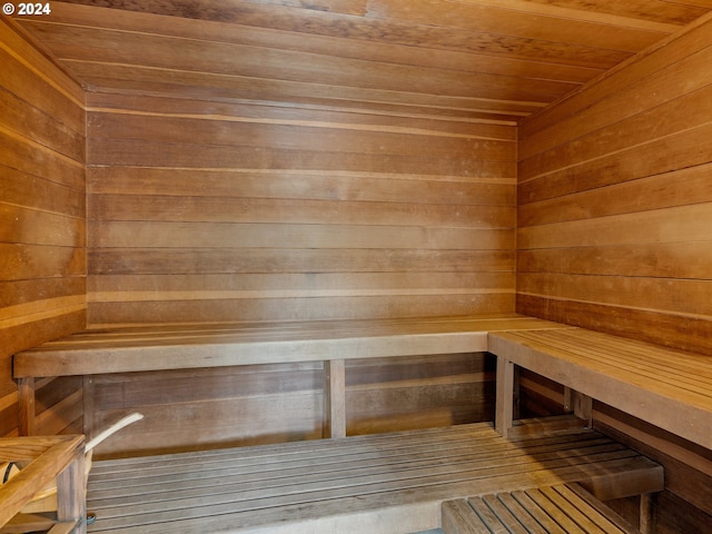 view of sauna with wood walls and wood ceiling