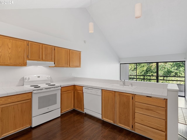 kitchen with sink, dark hardwood / wood-style flooring, tile countertops, and white appliances