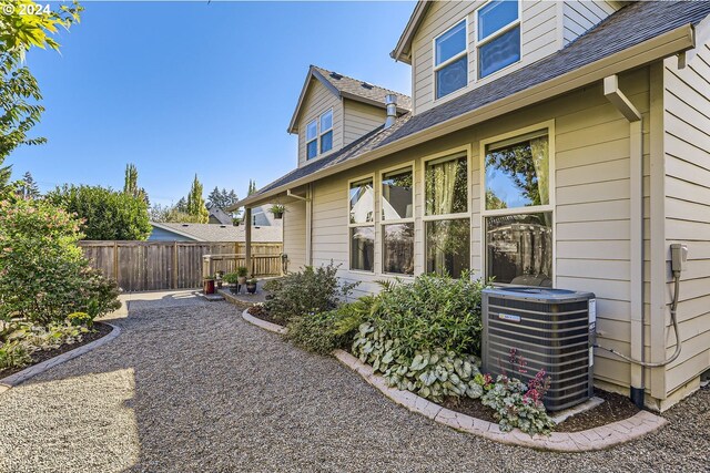 view of side of home featuring central AC and a patio