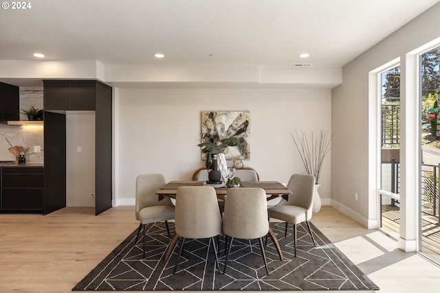 dining room with light wood-type flooring