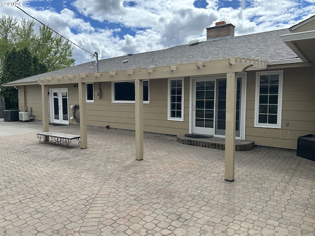 back of property featuring central AC unit, a patio, and french doors