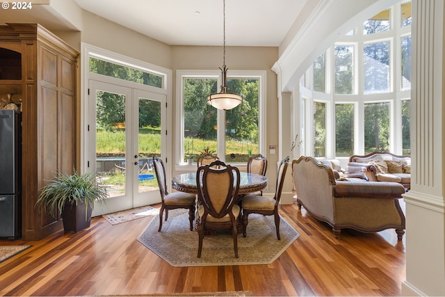 sunroom / solarium featuring french doors