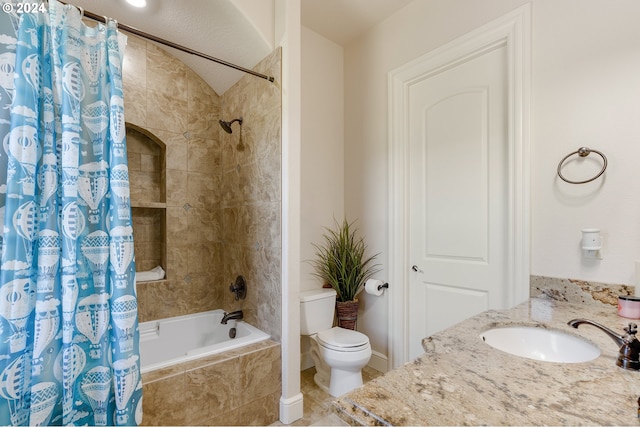 full bathroom featuring shower / bath combination with curtain, toilet, and vanity