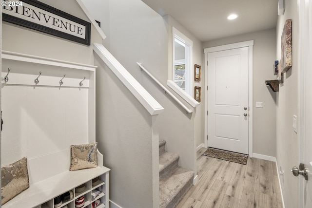 mudroom featuring recessed lighting, baseboards, and light wood-style flooring