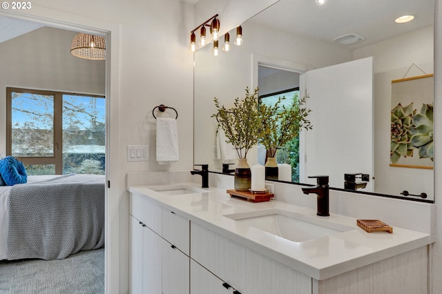 bathroom featuring dual vanity