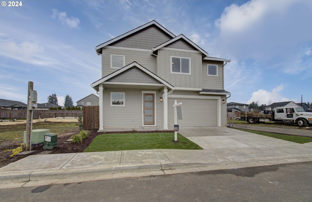 view of front of house featuring central AC and a garage