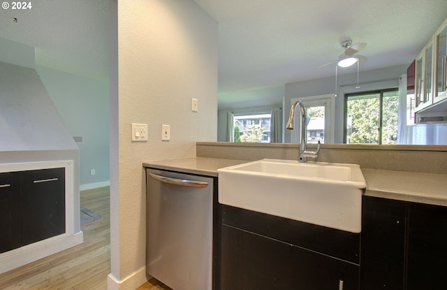 kitchen with light wood-type flooring, dishwasher, ceiling fan, and sink