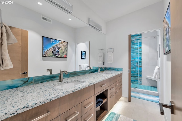 bathroom with tile patterned flooring, vanity, a wall mounted air conditioner, and walk in shower