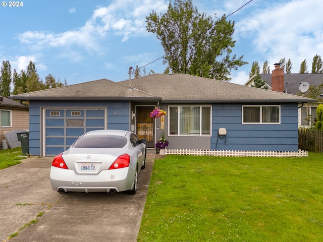 ranch-style home with a garage and a front lawn