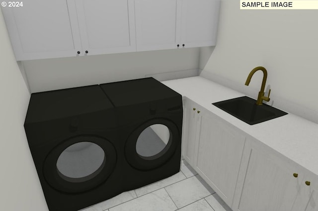 laundry room featuring cabinets, independent washer and dryer, light tile patterned floors, and sink