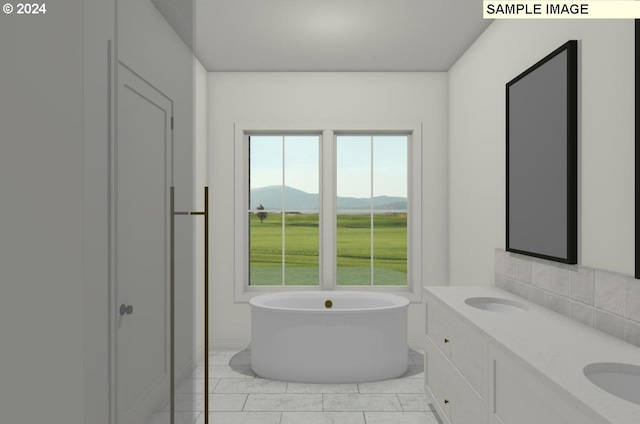 bathroom with a tub, a mountain view, tile patterned flooring, and vanity
