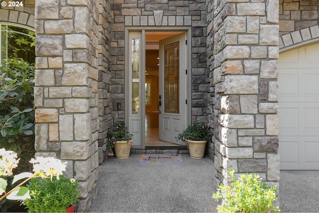 entrance to property featuring a garage