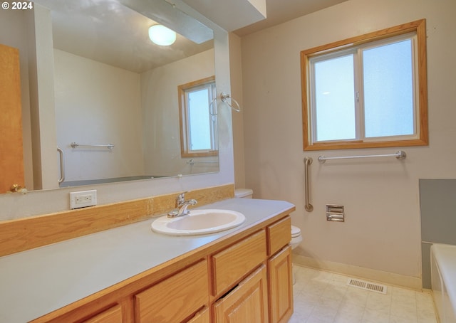 bathroom with vanity and toilet