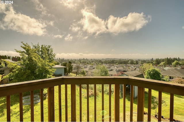 wooden deck featuring a yard