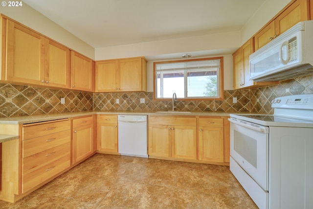 kitchen featuring decorative backsplash, white appliances, sink, and light brown cabinetry