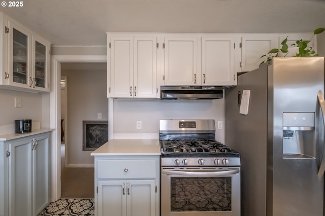 kitchen with stainless steel appliances and white cabinets