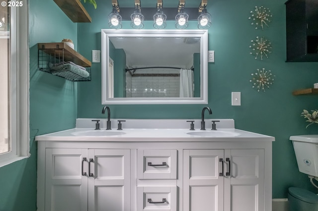 bathroom with vanity, toilet, and a shower with shower curtain