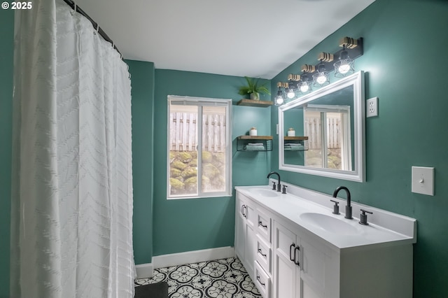 bathroom with vanity and tile patterned floors